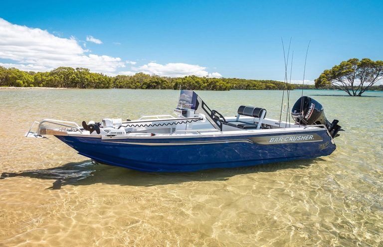 XS Series boat floting in clear shallow water near a beach